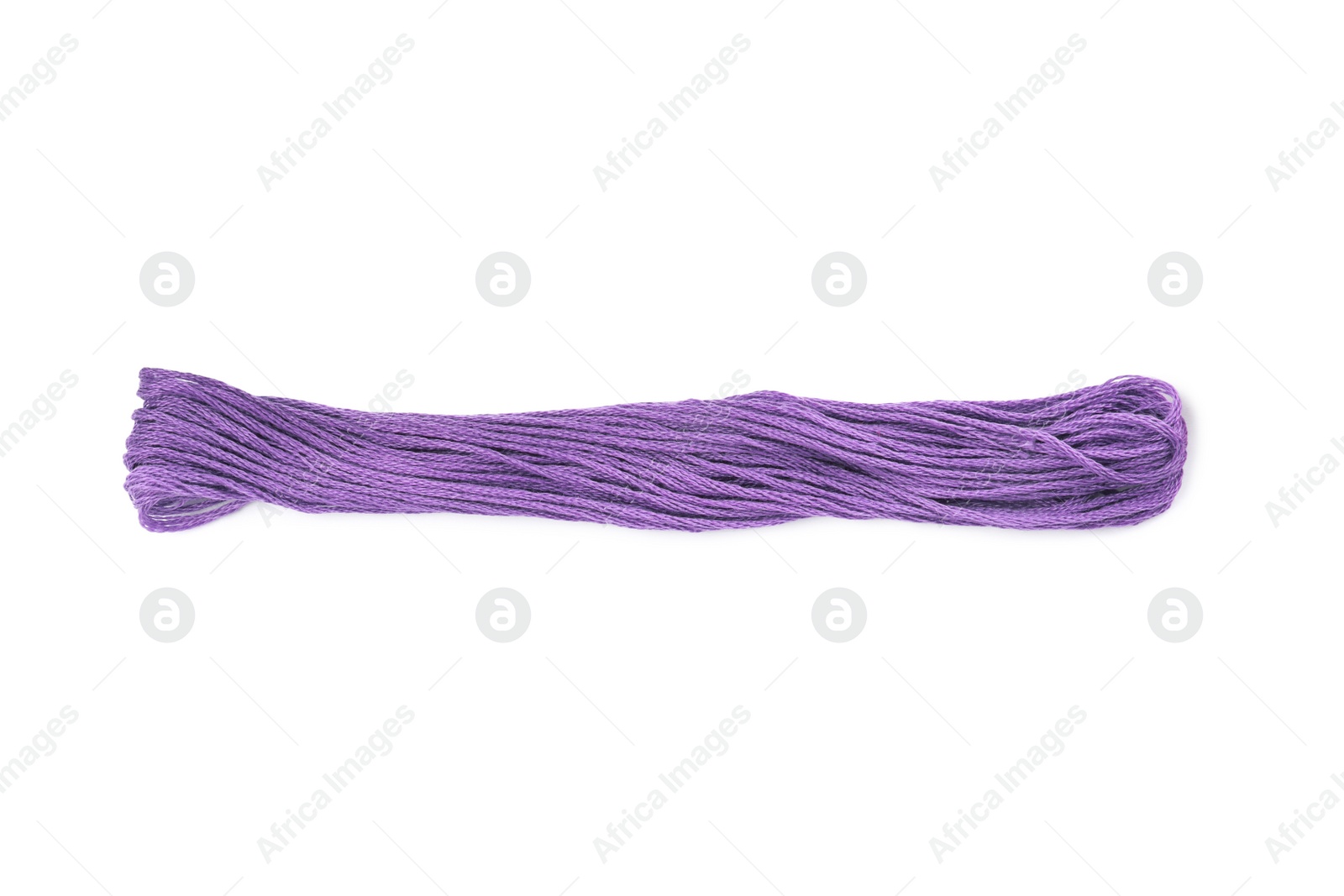 Photo of Bright violet embroidery thread on white background, top view