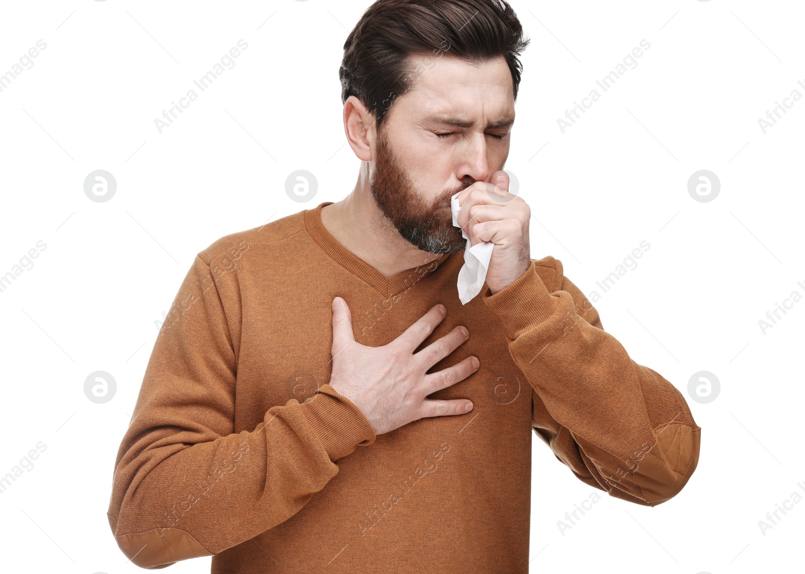 Photo of Sick man with tissue coughing on white background