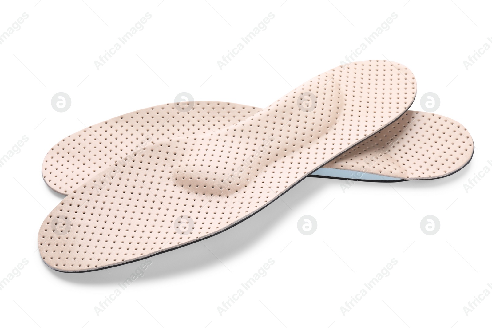 Photo of Beige comfortable orthopedic insoles isolated on white