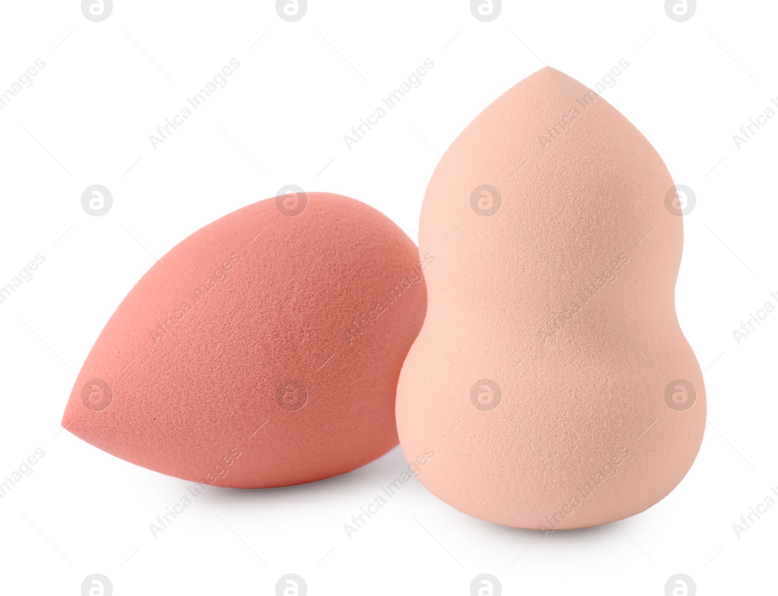 Photo of Two different make up sponges isolated on white