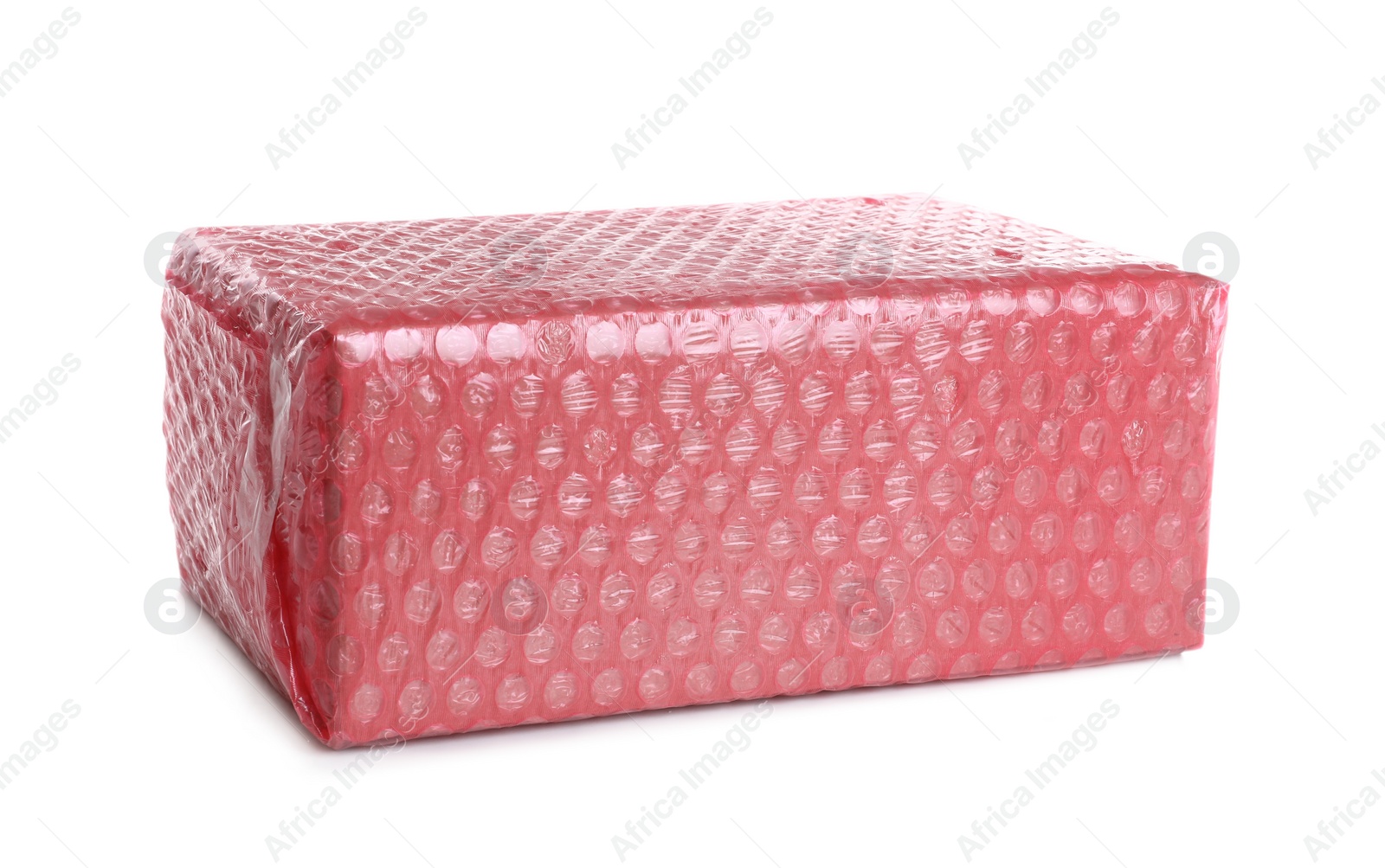 Photo of Cardboard box packed in red bubble wrap isolated on white