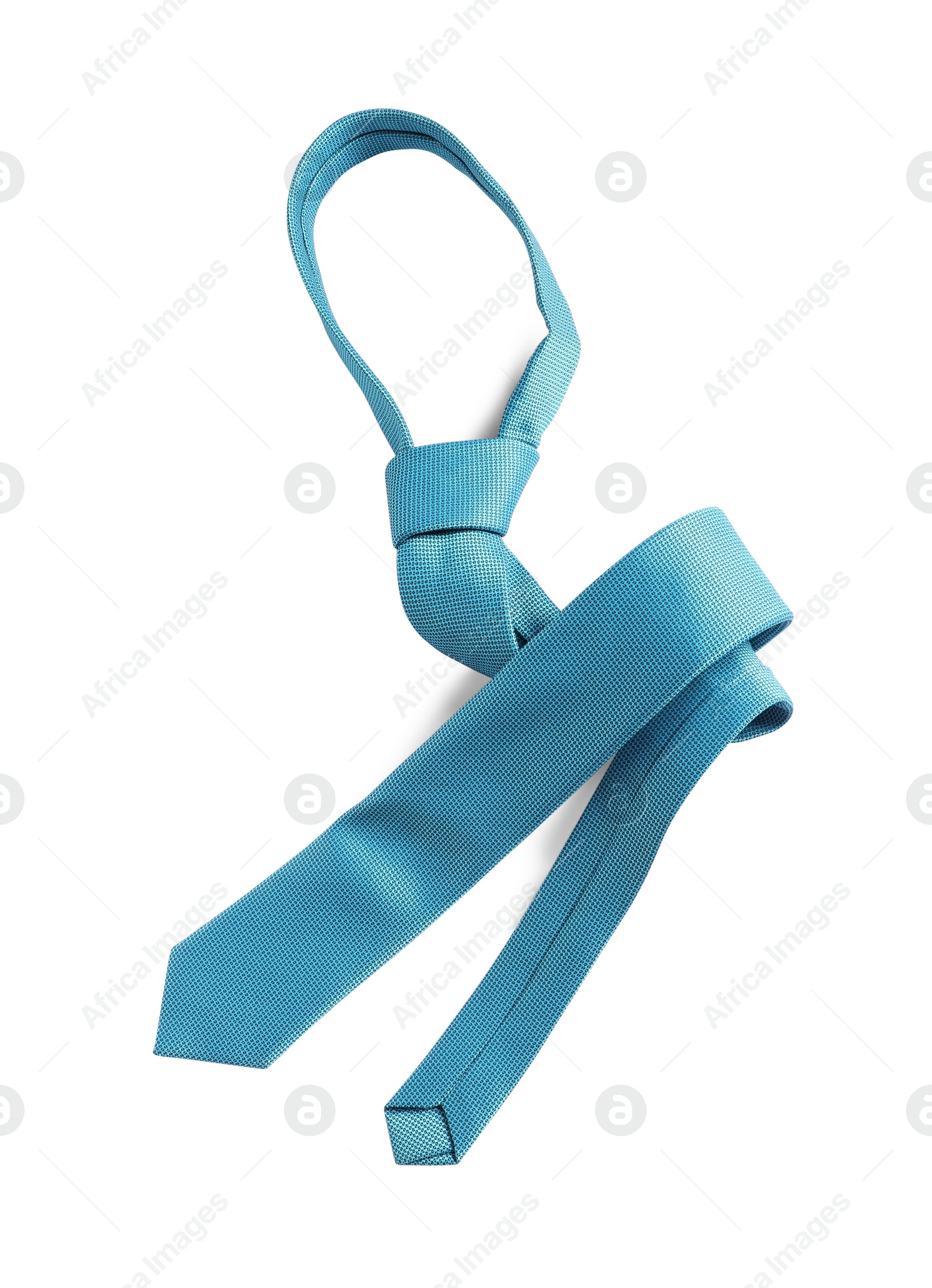 Photo of One light blue necktie isolated on white, top view