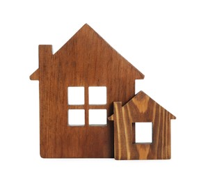Photo of Wooden house models on white background. Saving money concept