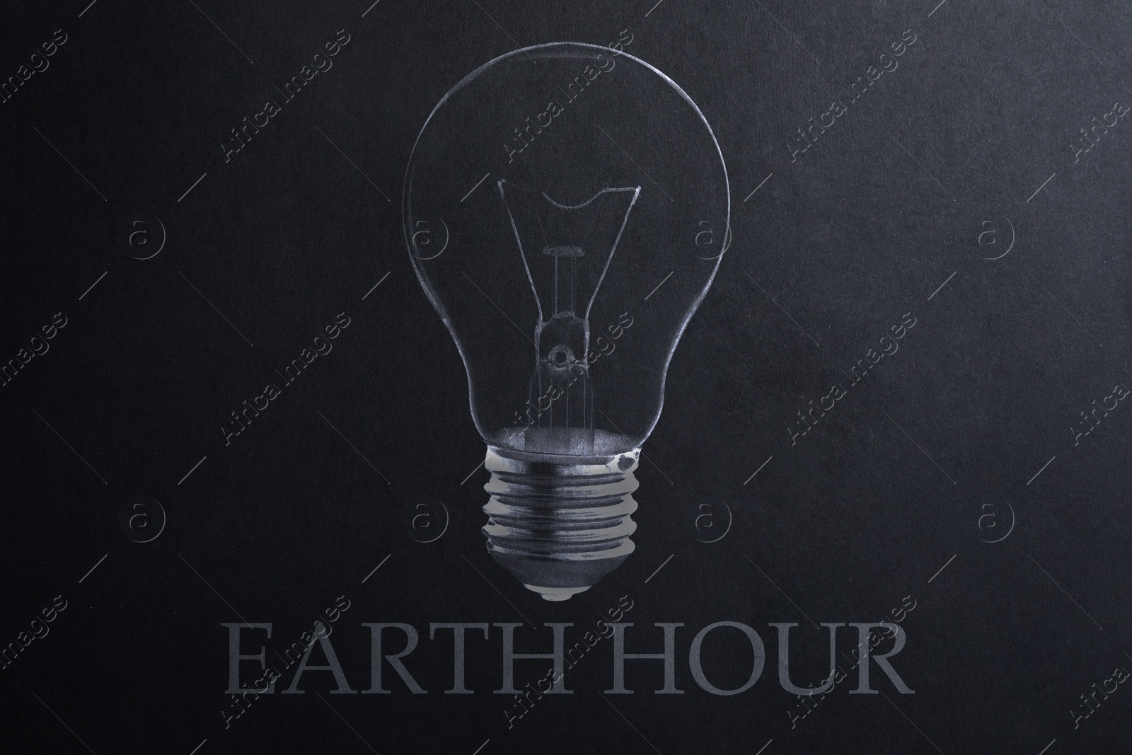 Image of Earth hour concept. Drawing of light bulb on black paper