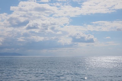 Photo of Picturesque view of sea under beautiful sky with fluffy clouds