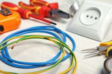 Set of electrician's tools on light table