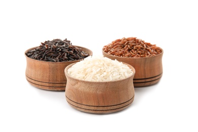 Photo of Bowls with different types of rice on white background