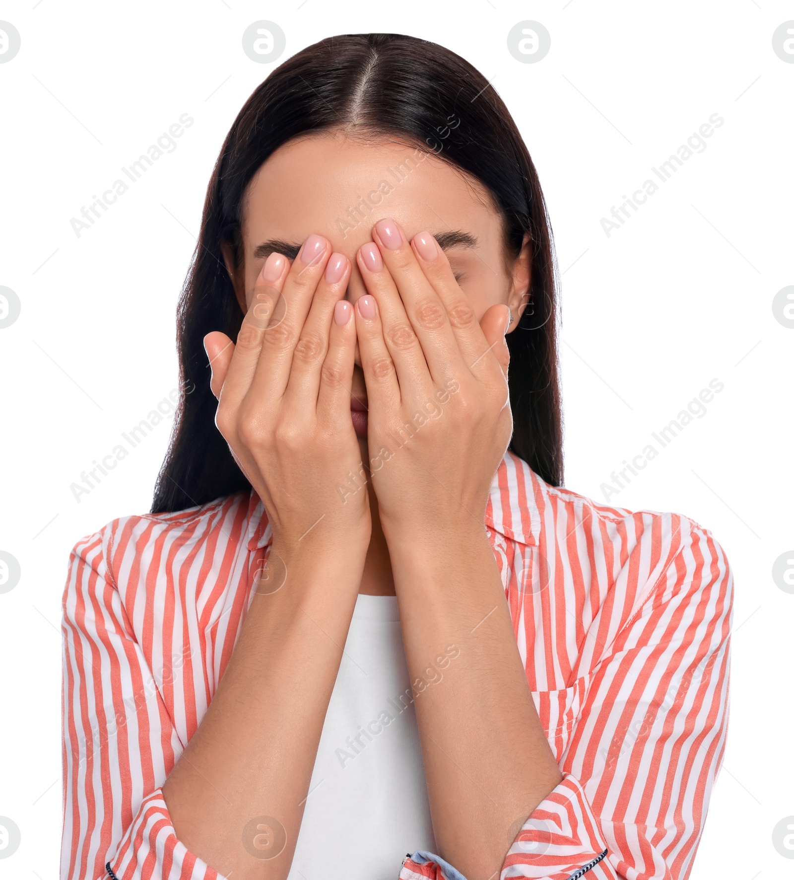 Photo of Embarrassed young woman covering face with hands on white background