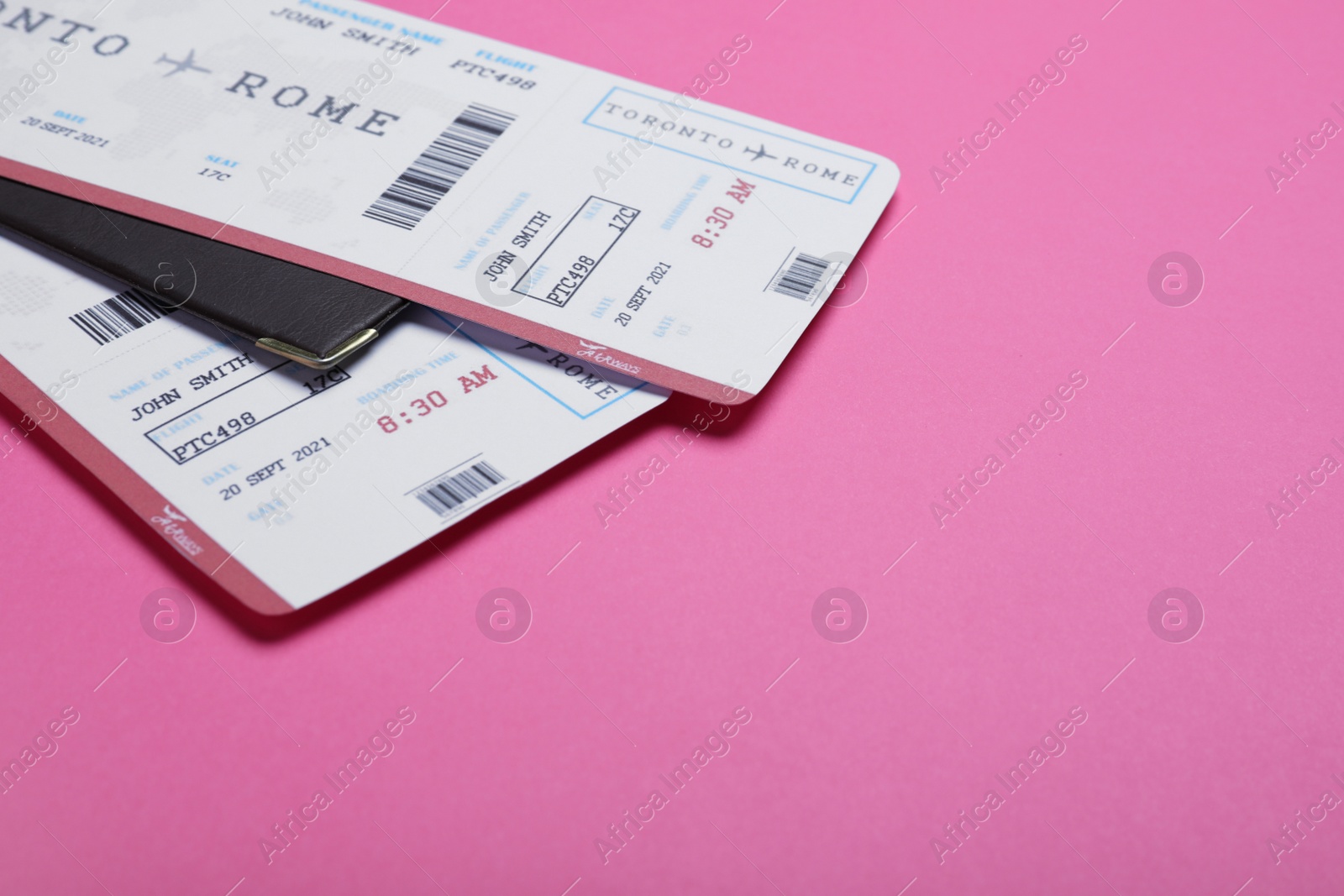 Photo of Tickets and passport on pink background, space for text. Travel agency concept