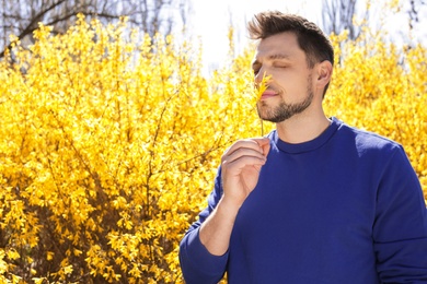 Photo of Happy healthy man enjoying springtime outdoors, space for text. Allergy free concept