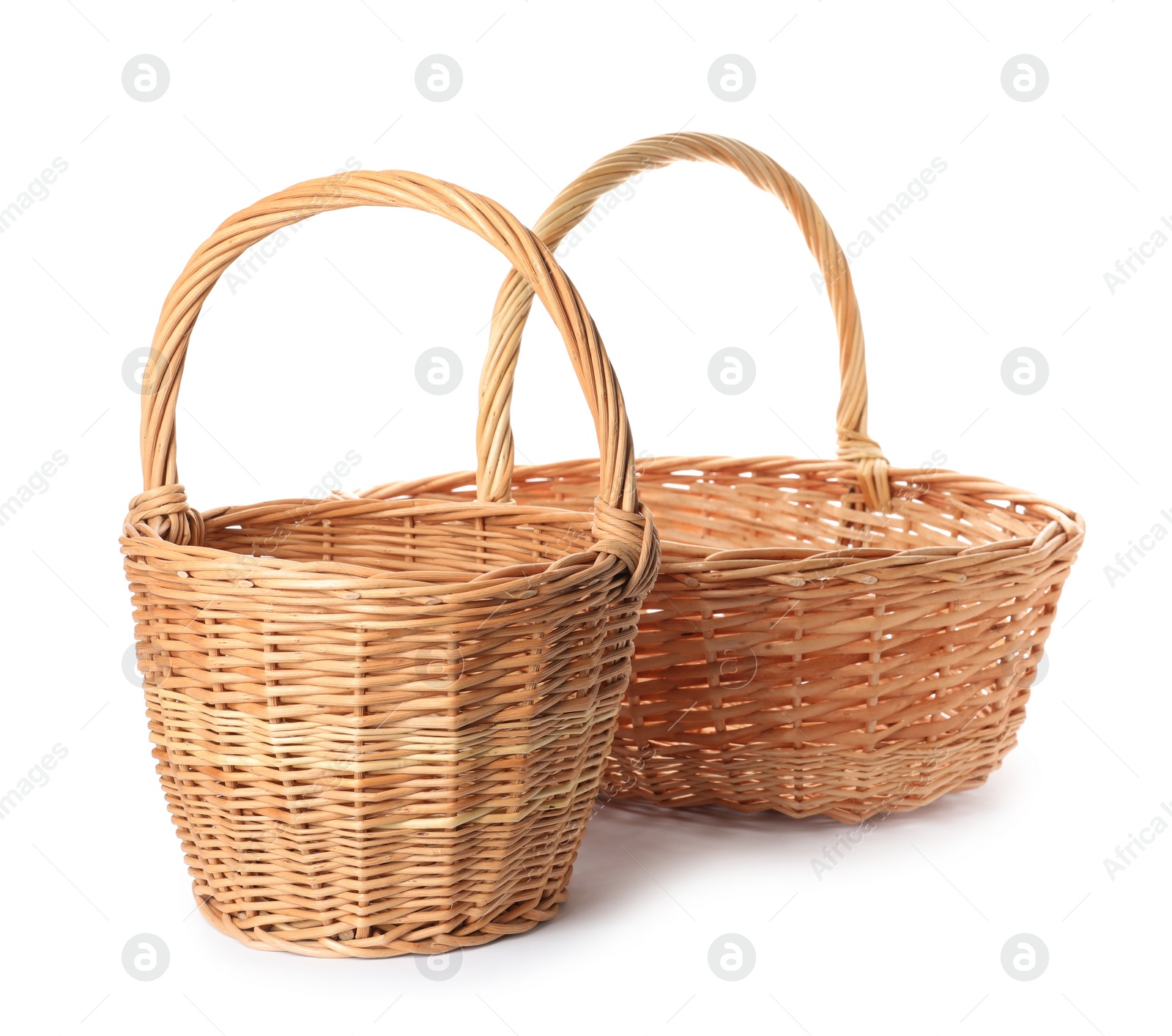 Photo of Two decorative wicker baskets on white background