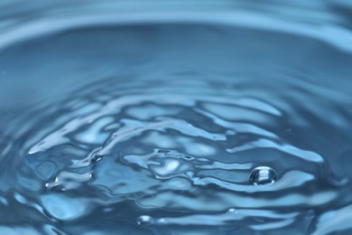 Clear rippled water with bubbles, closeup view