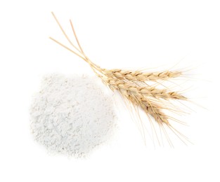 Photo of Pile of wheat flour and spikes isolated on white, top view