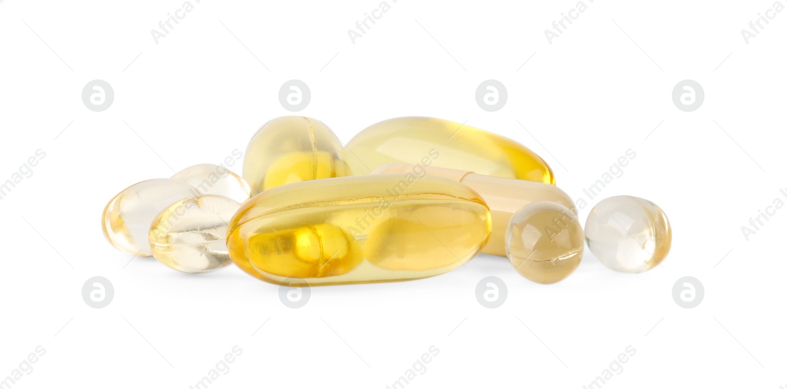 Photo of Many different vitamin capsules isolated on white