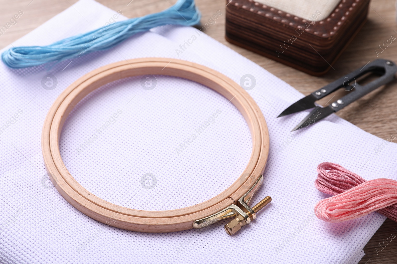 Photo of Set of embroidery equipment on wooden table