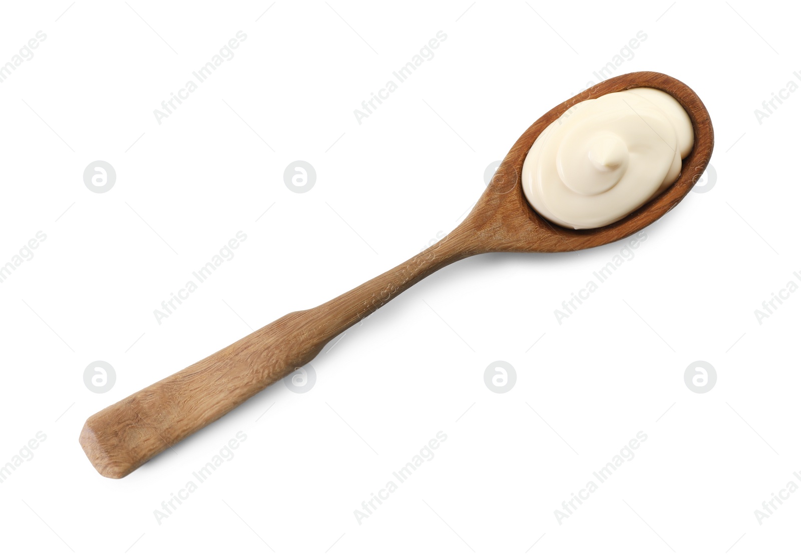 Photo of Natural yogurt in wooden spoon isolated on white, top view