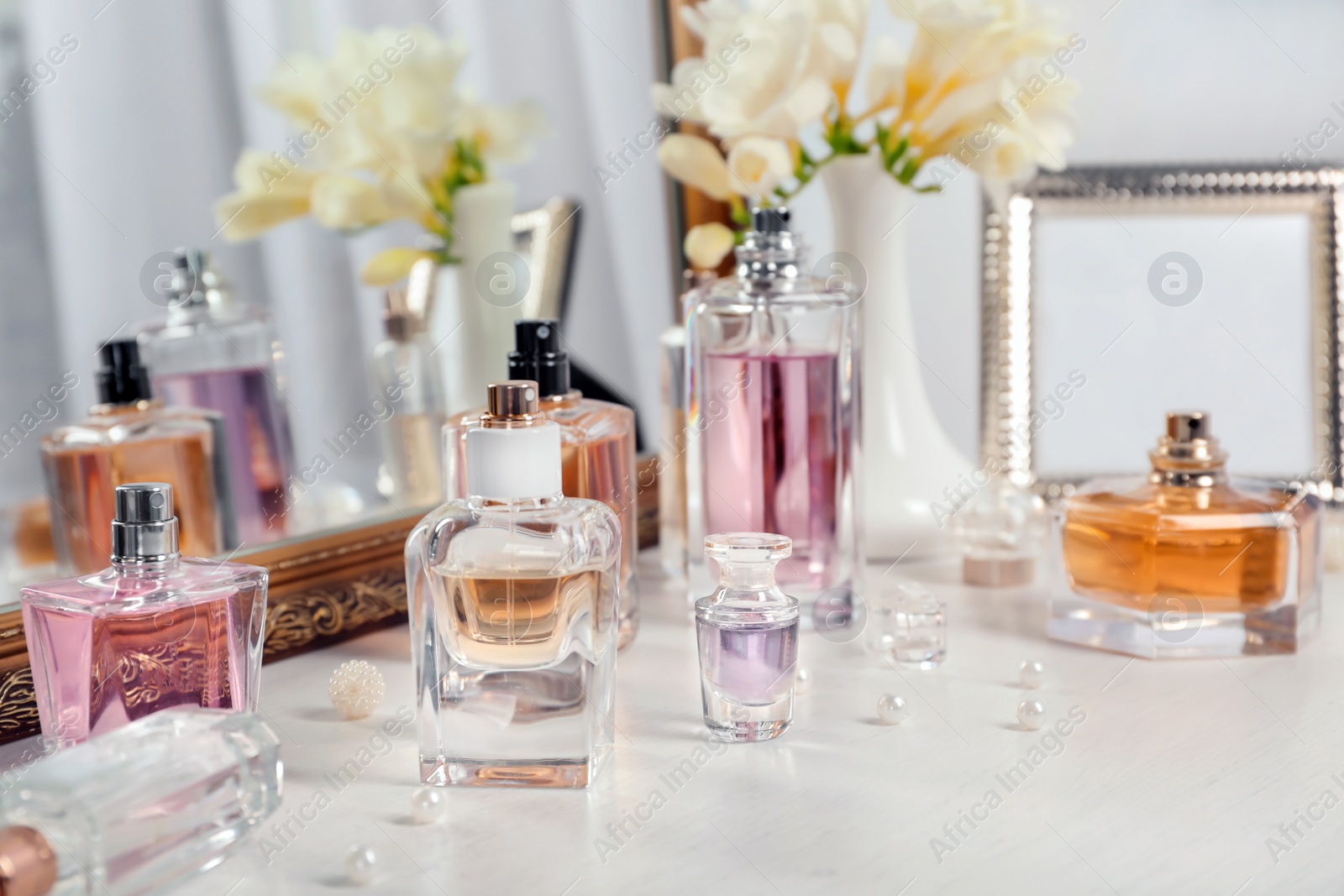 Photo of Perfume bottles on dressing table