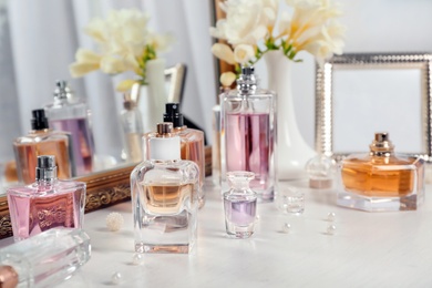 Photo of Perfume bottles on dressing table