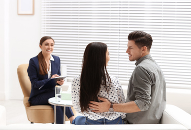 Professional psychologist working with couple in office