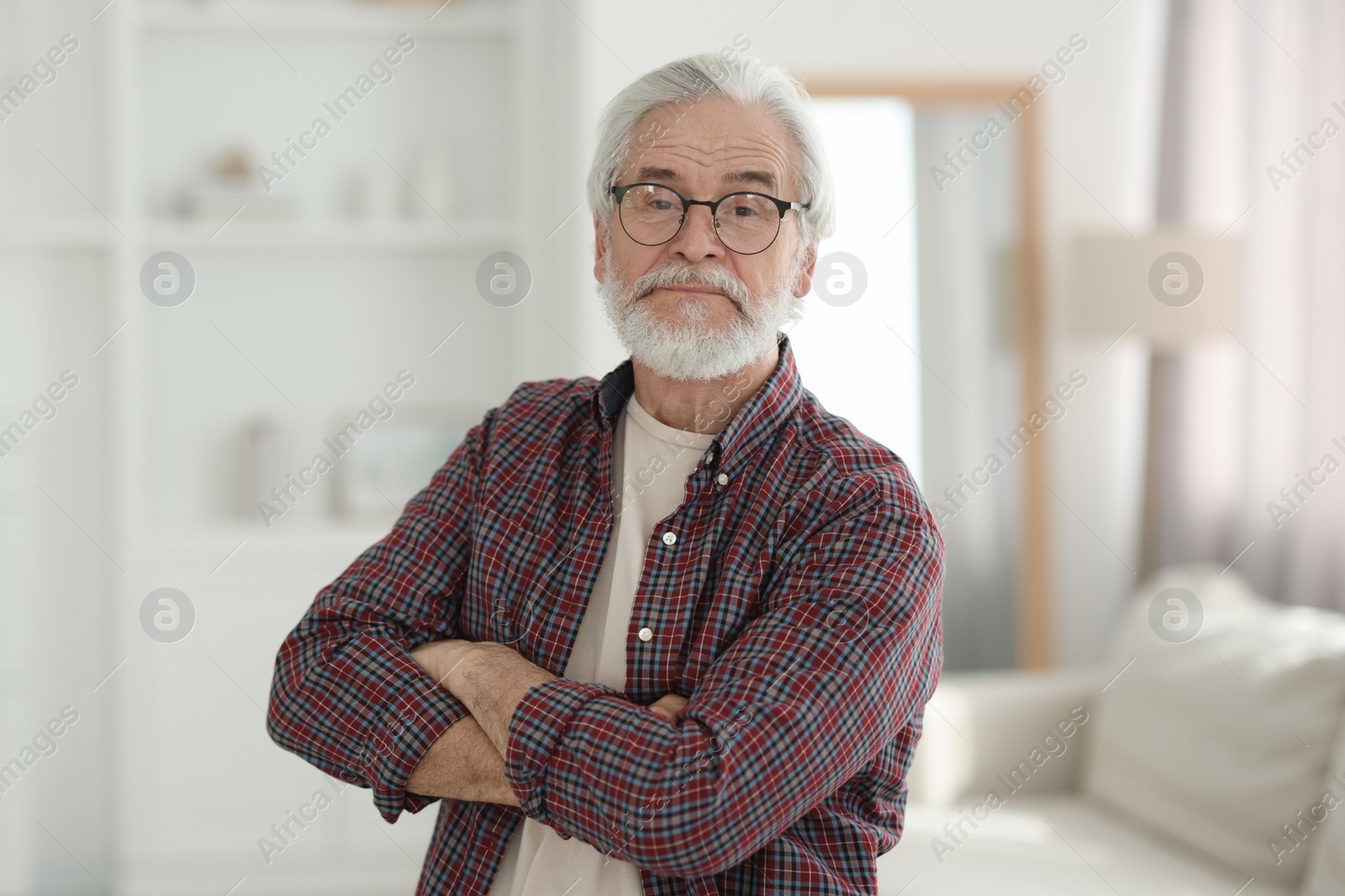 Photo of Portrait of happy grandpa with glasses indoors