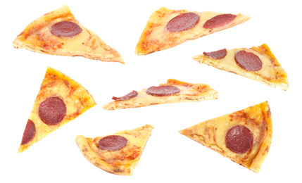 Set with slices of pepperoni pizza on white background