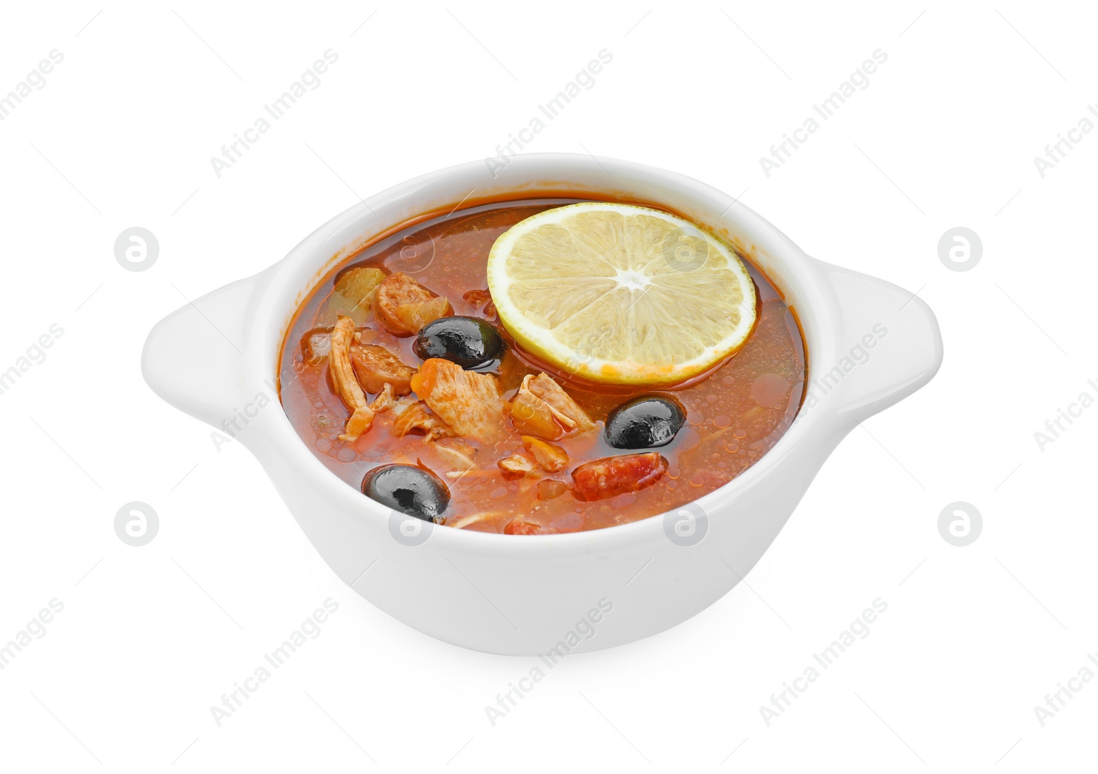 Photo of Meat solyanka soup with sausages, olives and vegetables in bowl isolated on white