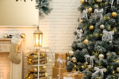 Photo of Decorated Christmas tree in modern living room interior