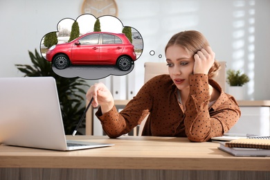 Young woman dreaming about new car in office
