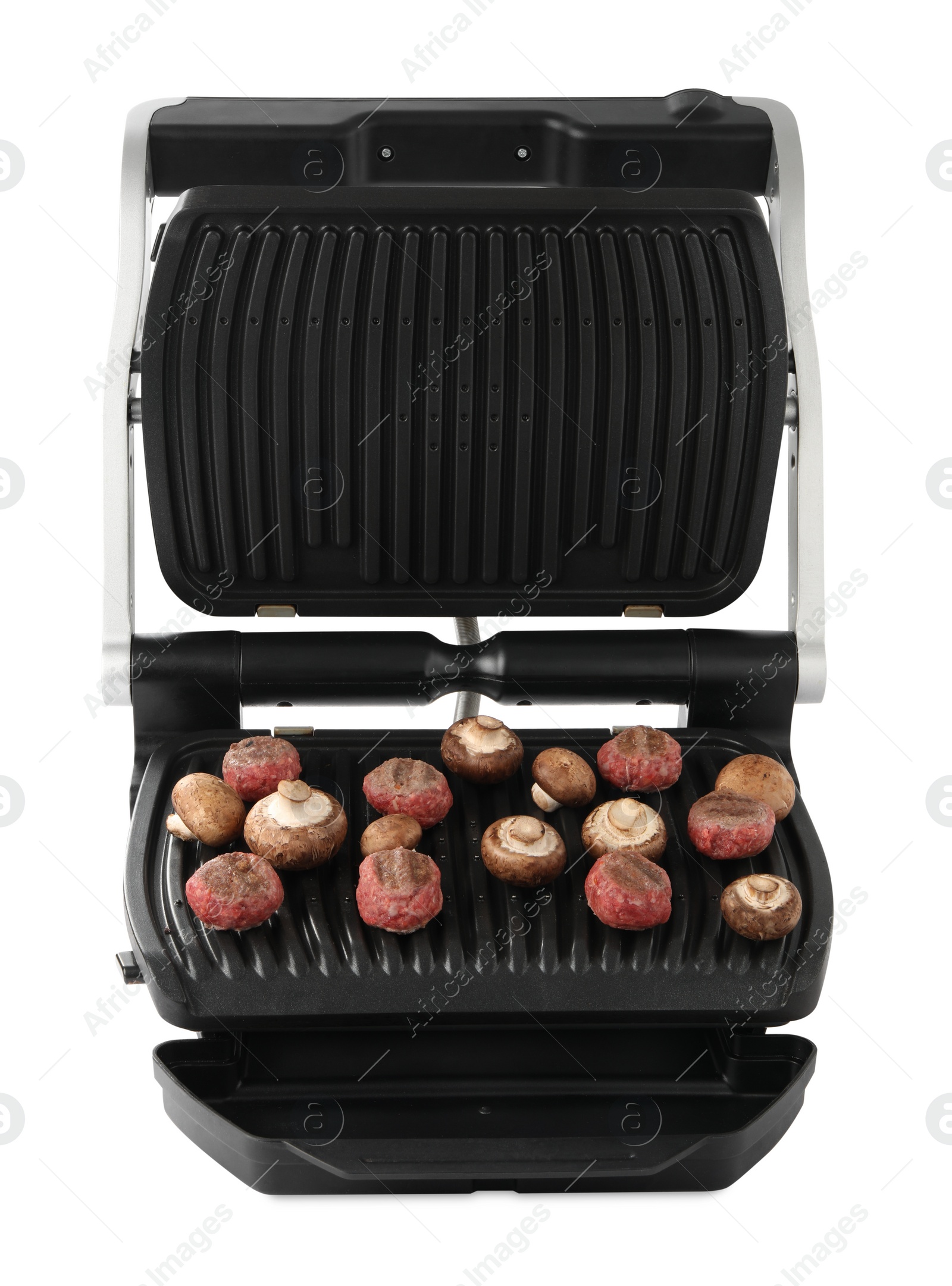 Photo of Electric grill with meat balls and mushrooms isolated on white