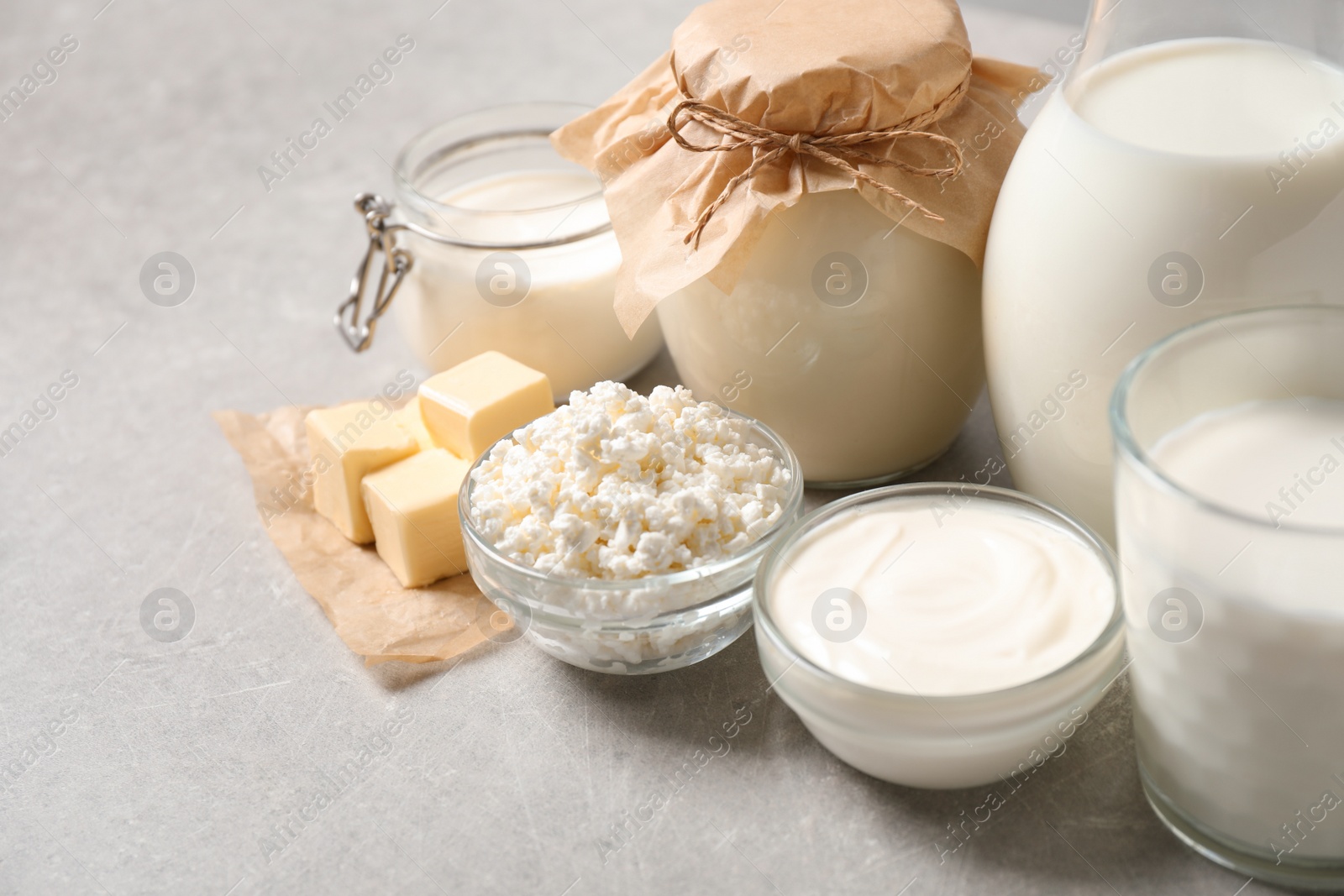 Photo of Different delicious dairy products on light table