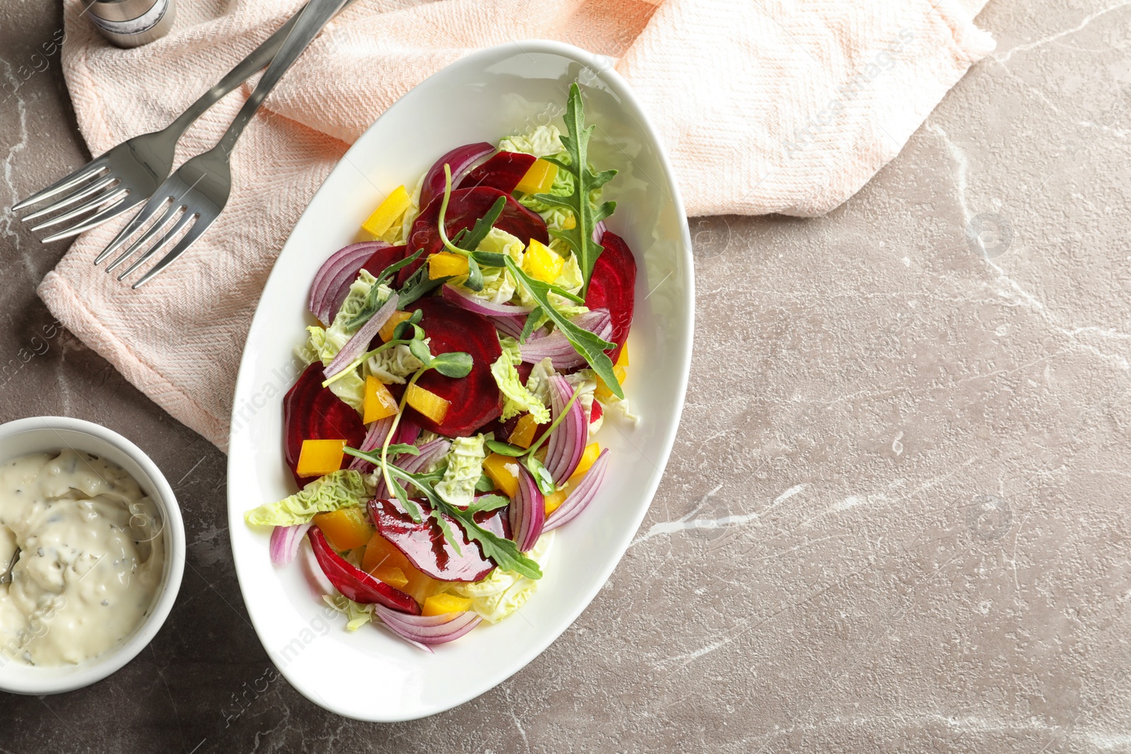 Photo of Tasty beets salad on table, flat lay composition with space for text