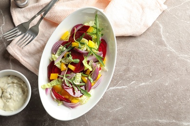 Tasty beets salad on table, flat lay composition with space for text