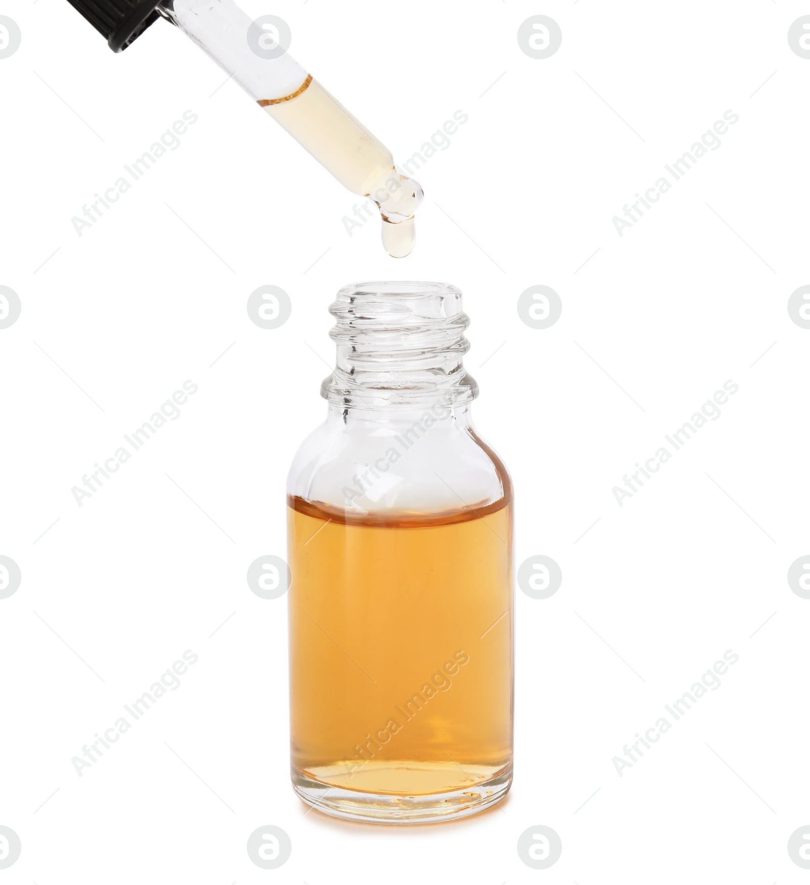 Photo of Bottle and dropper with essential oil on white background