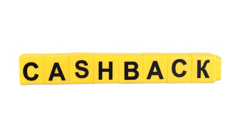 Photo of Yellow cubes with word Cashback on white background