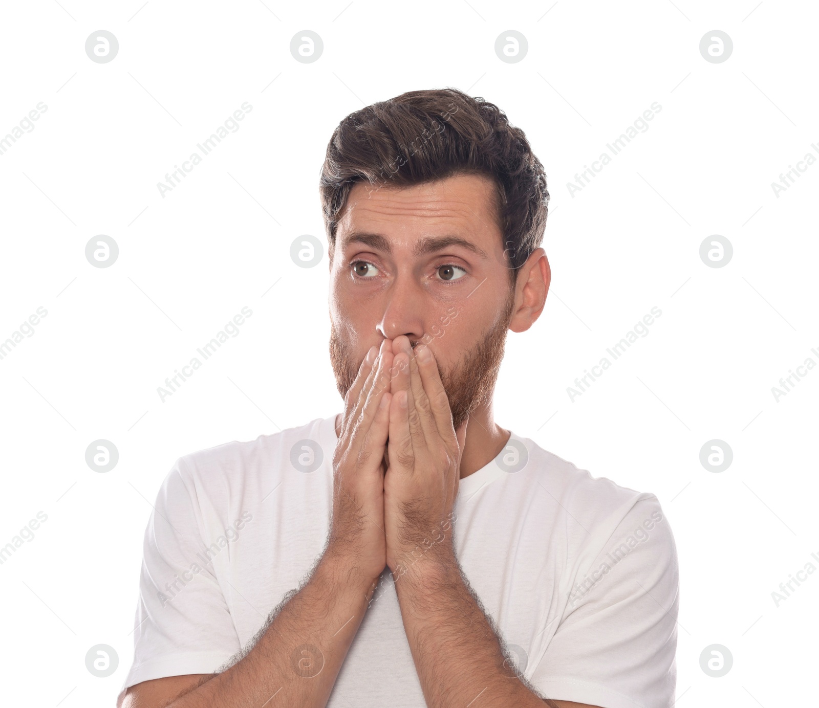 Photo of Embarrassed man covering face with hands on white background