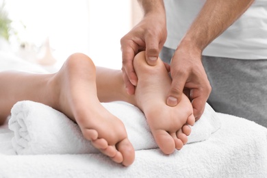 Young woman receiving massage in salon, closeup