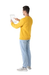 Man using tablet with blank screen on white background