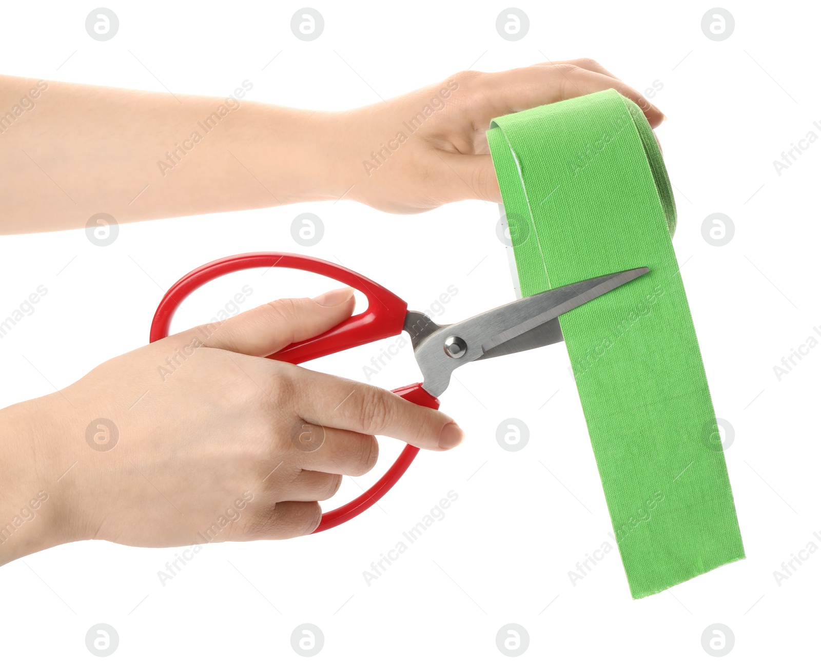 Photo of Woman cutting bright kinesio tape on white background, closeup