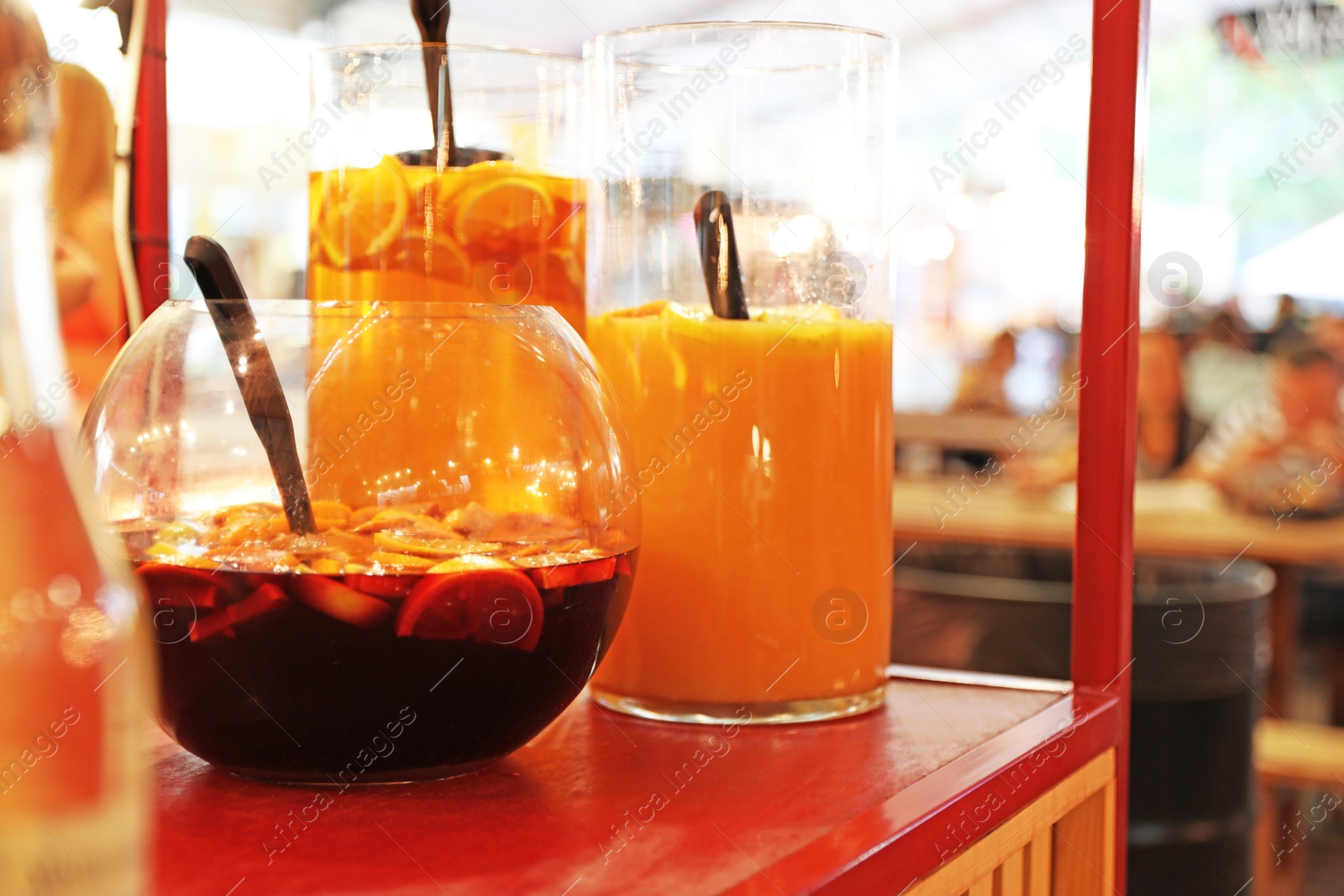 Photo of Delicious refreshing drinks in glass jars on table