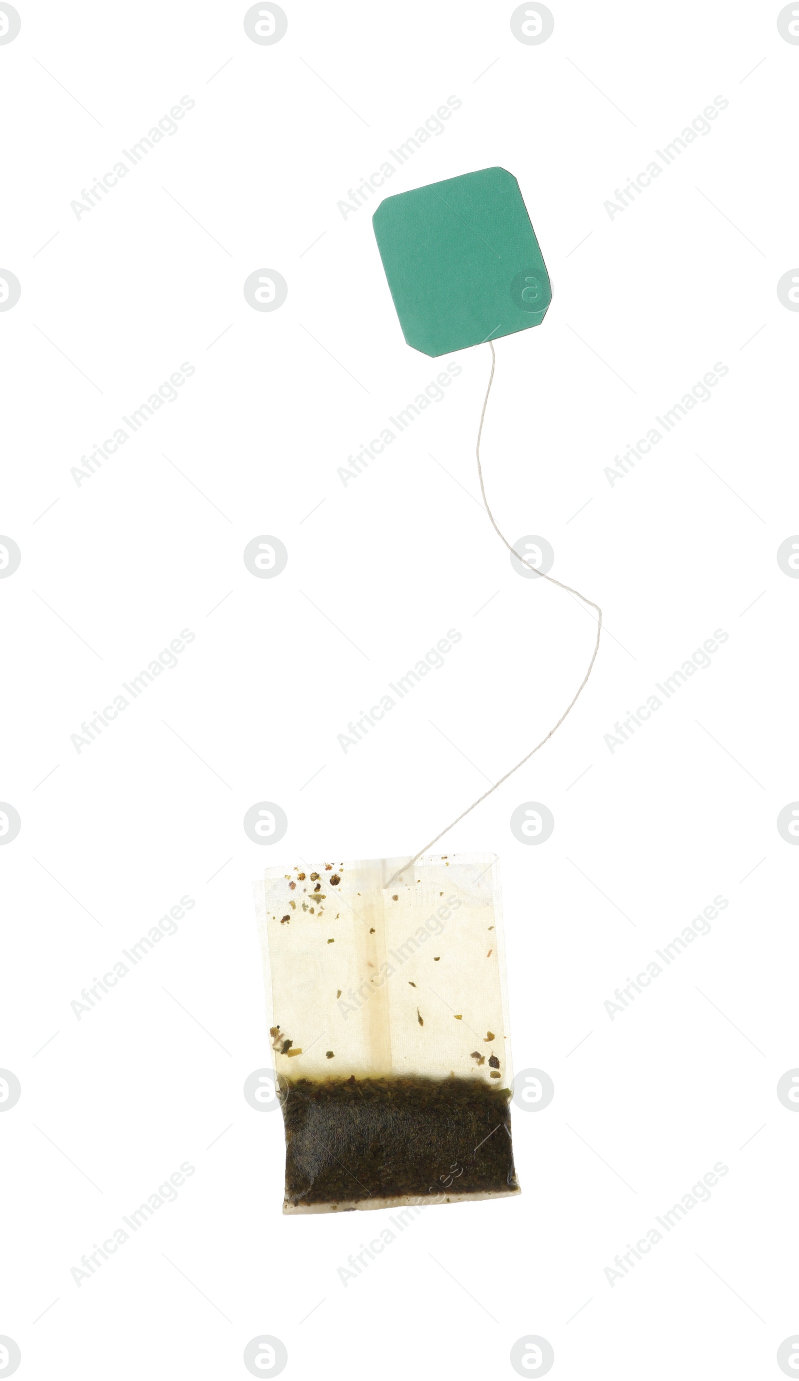 Photo of Used tea bag with tag isolated on white