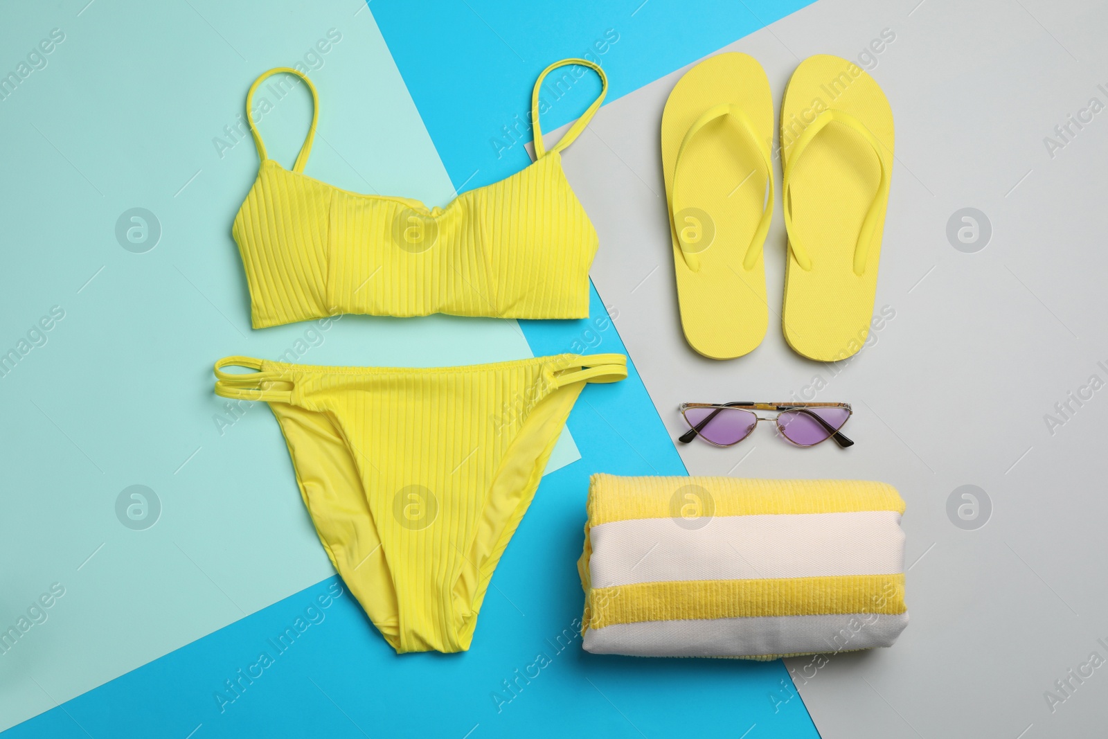 Photo of Flat lay composition with beach objects on color background