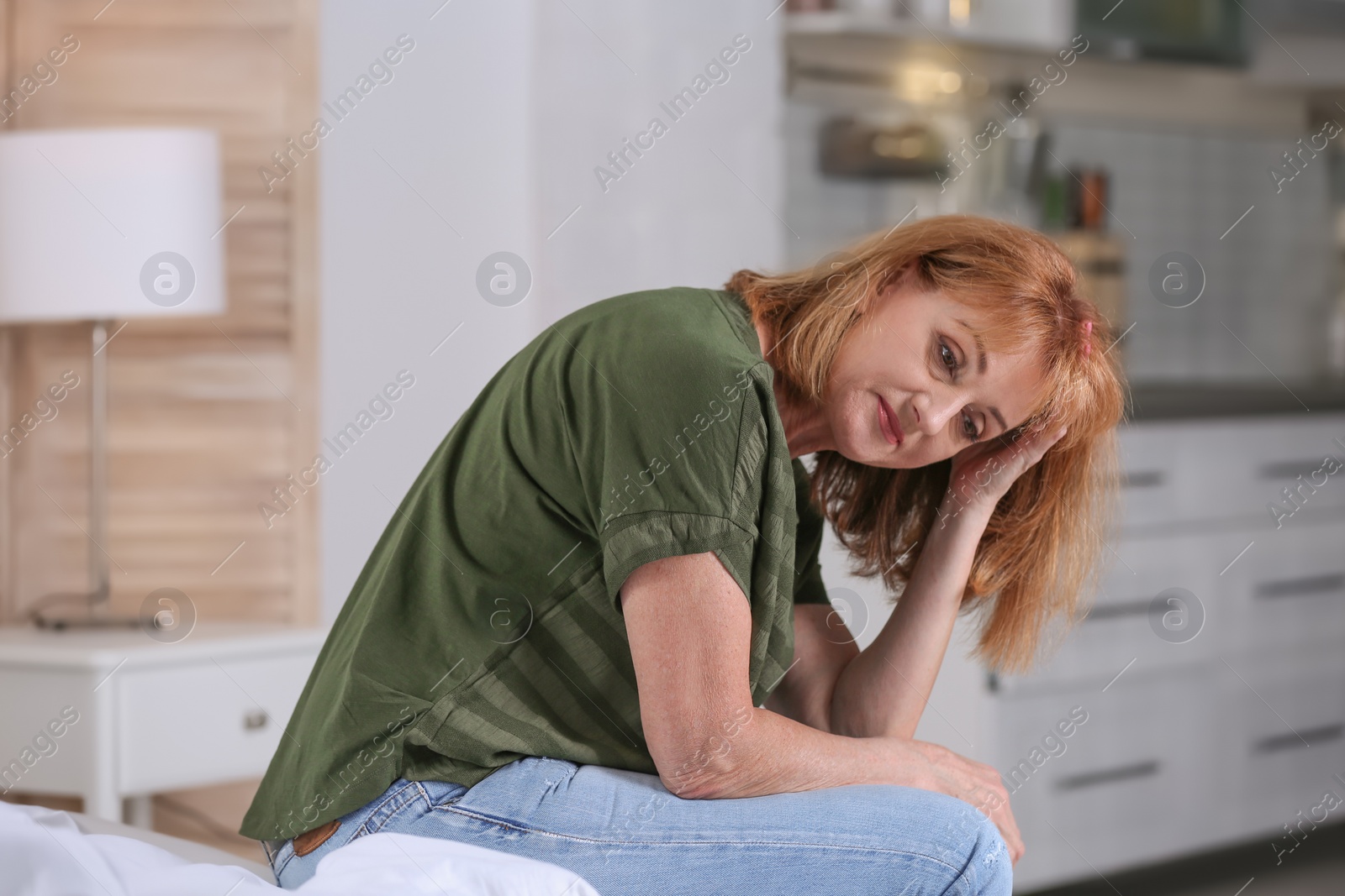 Photo of Senior woman suffering from depression at home