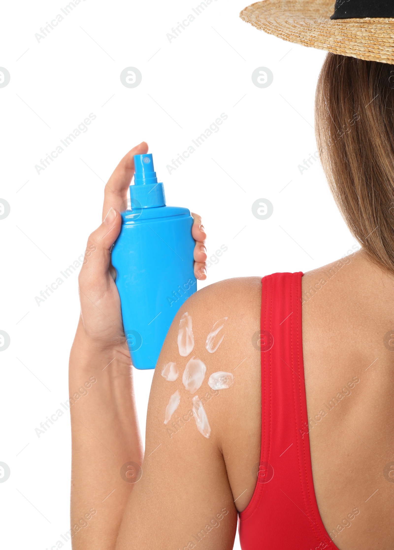 Photo of Woman with bottle of sun protection body cream on white background