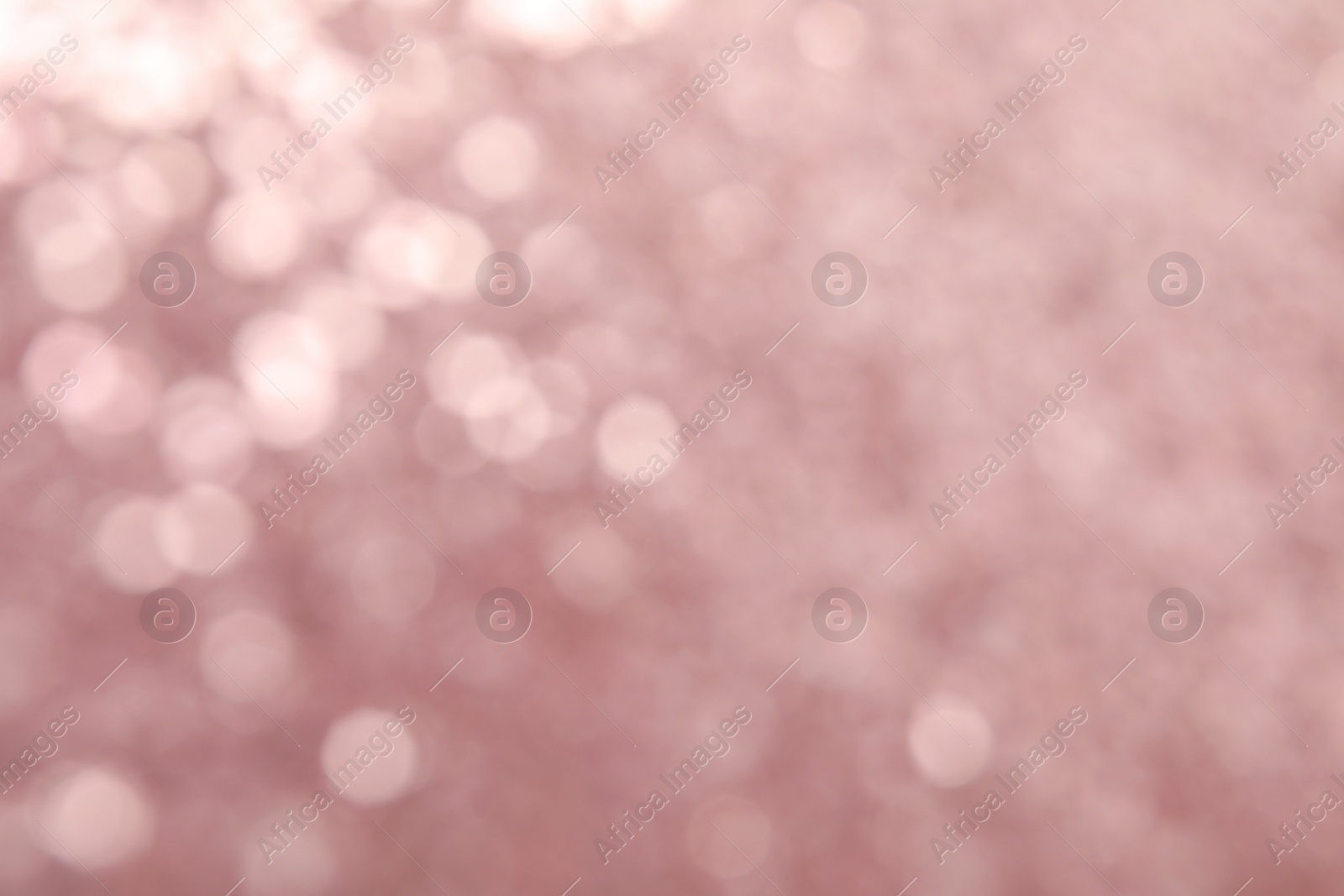 Photo of Blurred view of color glitter as background