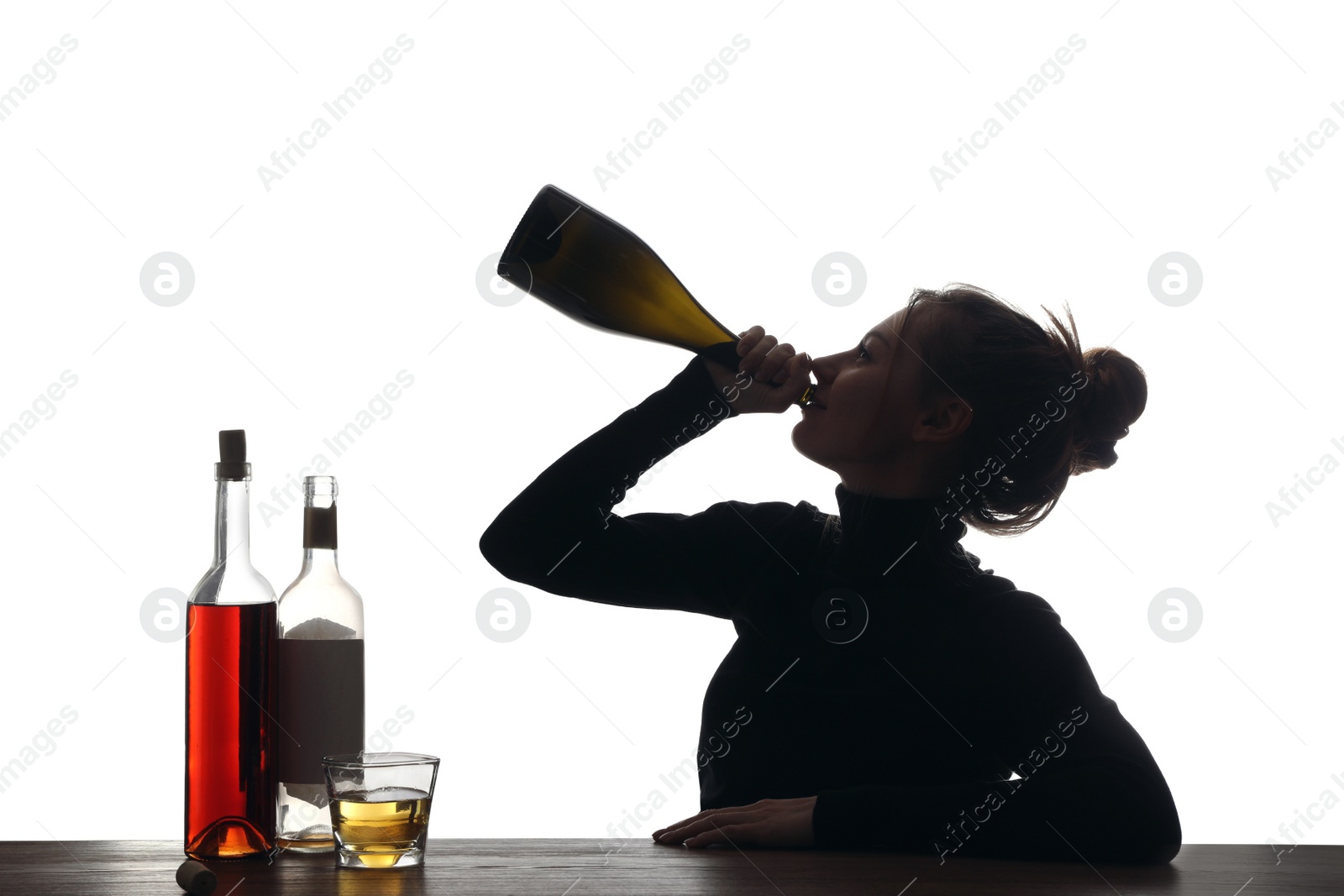 Photo of Alcohol addiction. Woman drinking sparkling wine from bottle on white background