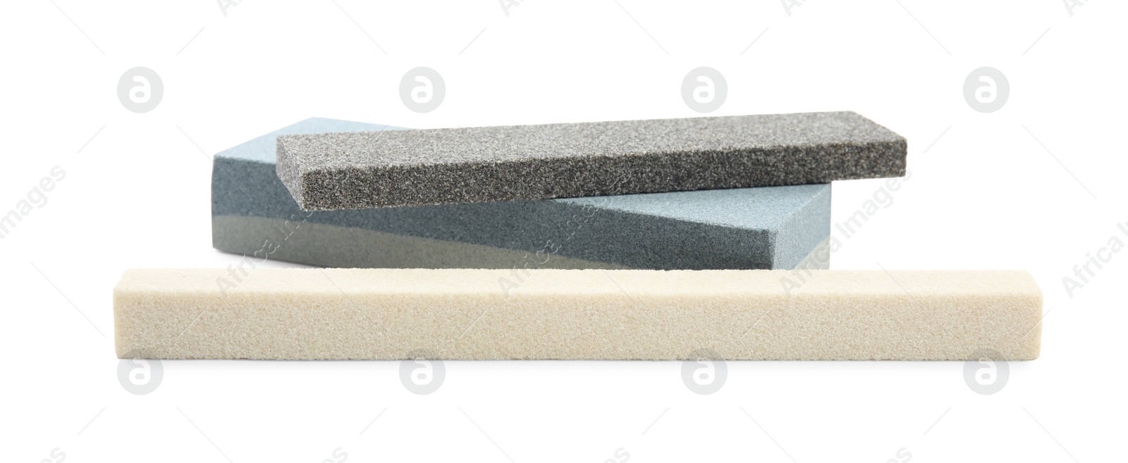 Photo of Sharpening stones for knife on white background