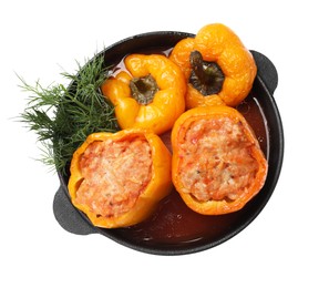 Photo of Tasty stuffed peppers and dill in pan isolated on white, top view