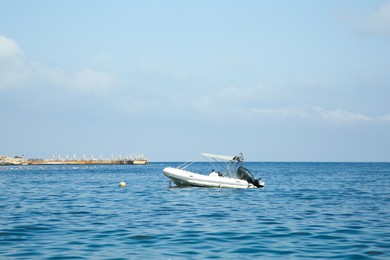 Photo of Inflatable boat on sea under blue sky