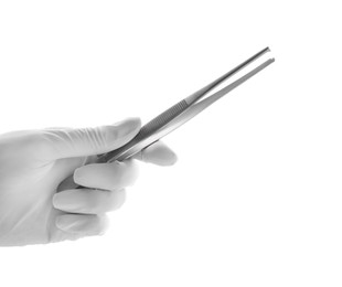 Photo of Doctor holding surgical forceps on white background, closeup. Medical instrument
