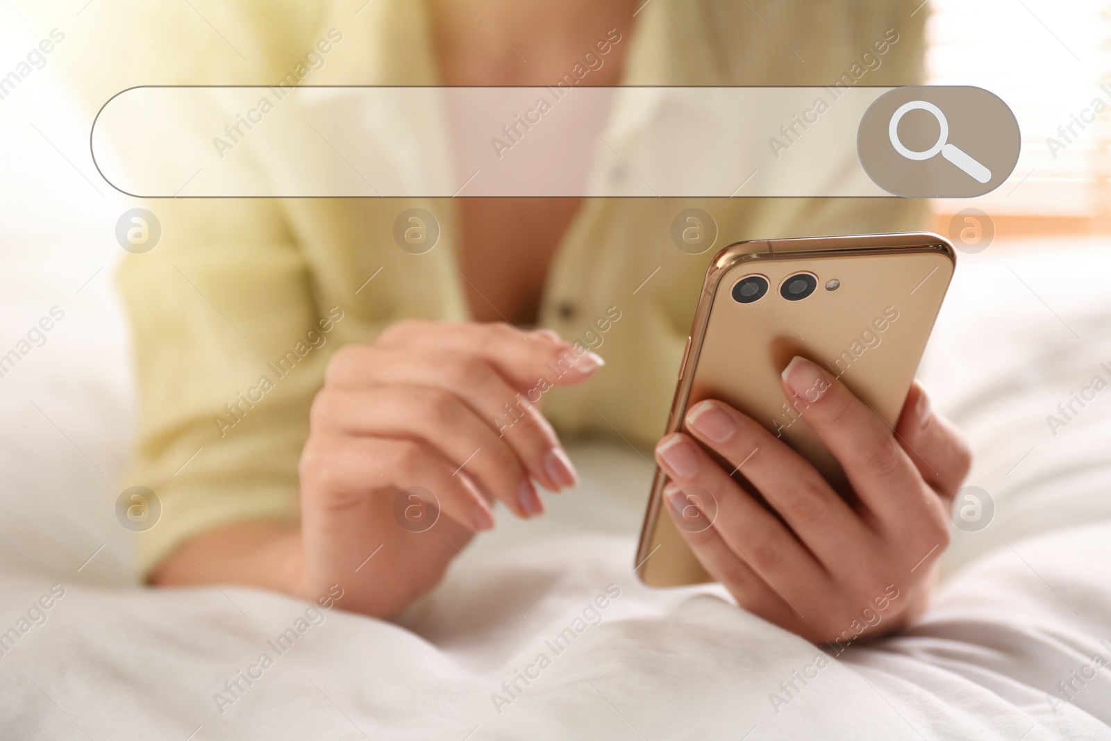 Image of Search bar of internet browser and woman using smartphone on bed at home, closeup